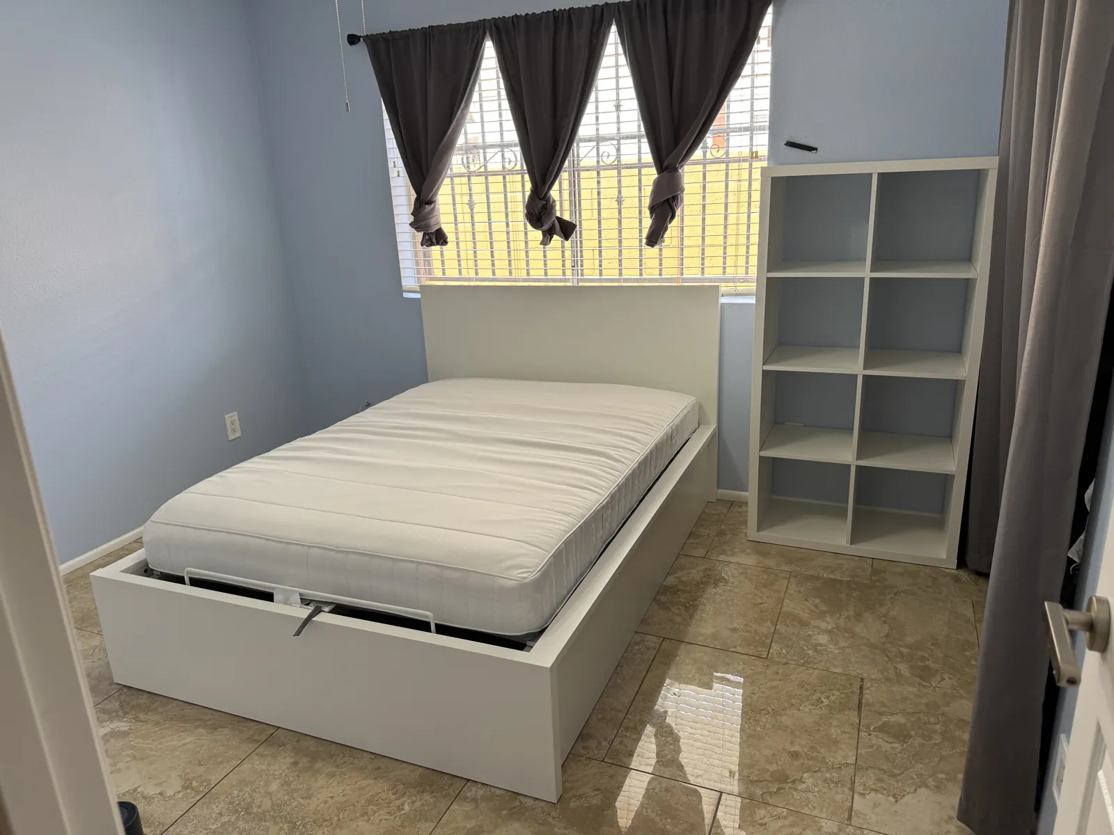 Completed HandyMack storage bed and bookshelf assembly.